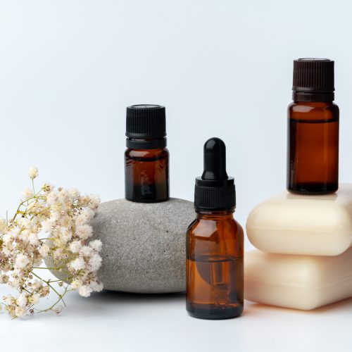 Spa stones and soap on white background, close up